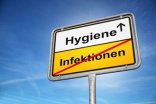 Ein Straßenschild, das den Ort Infektionen verlässt und zur Hygiene hinleitet.